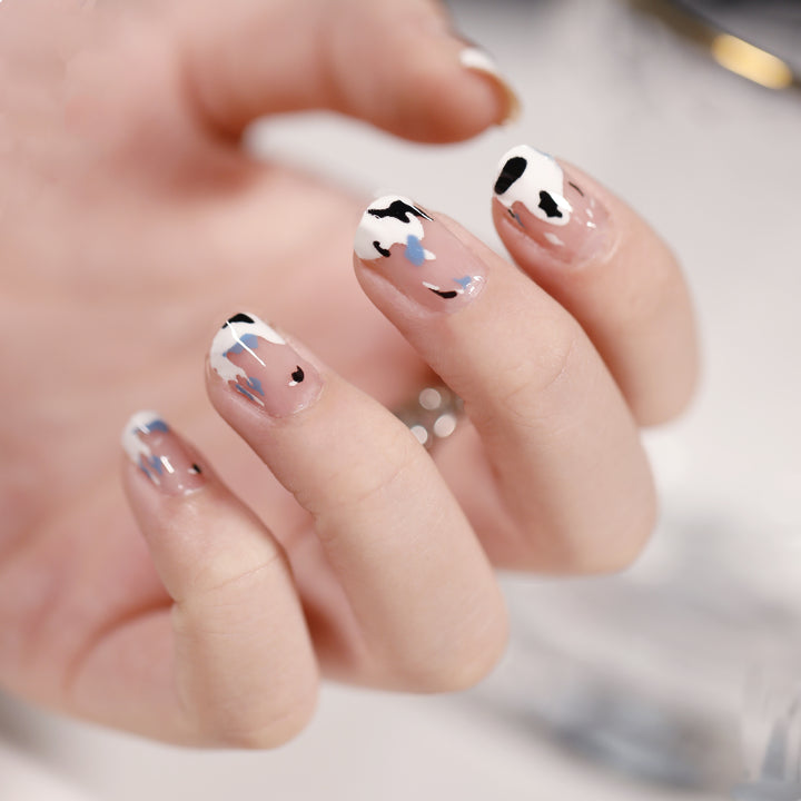 Artificial nail art with heart-shaped designs and soft color gradients Stornfield