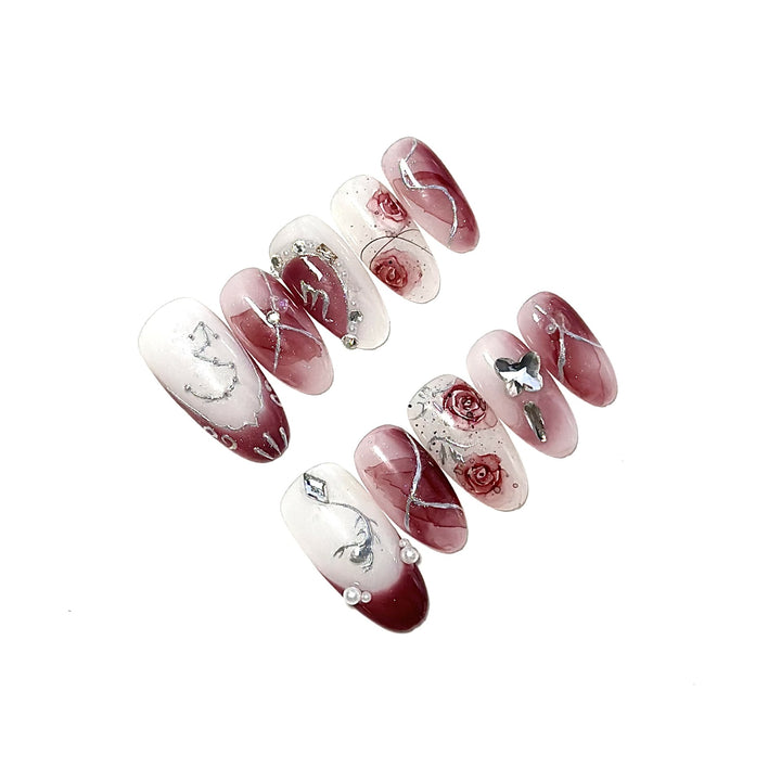 Artistic Press-On Nail Set with Floral Designs and Gem Accents