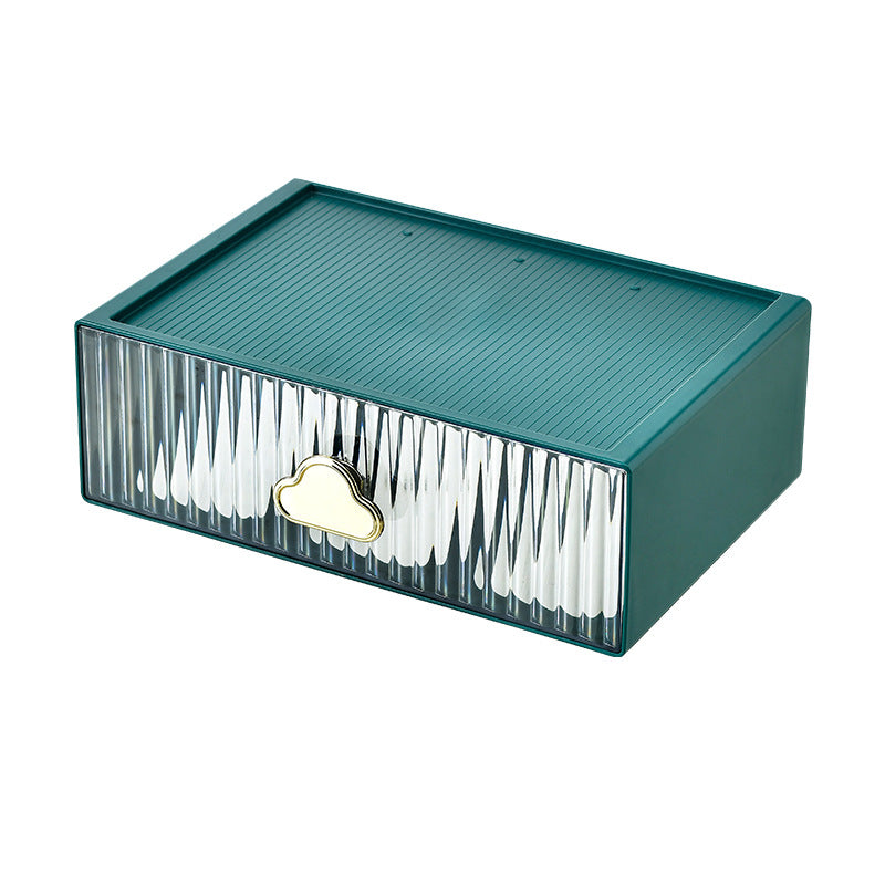 Small jewelry storage box with ribbed front and decorative cloud handle