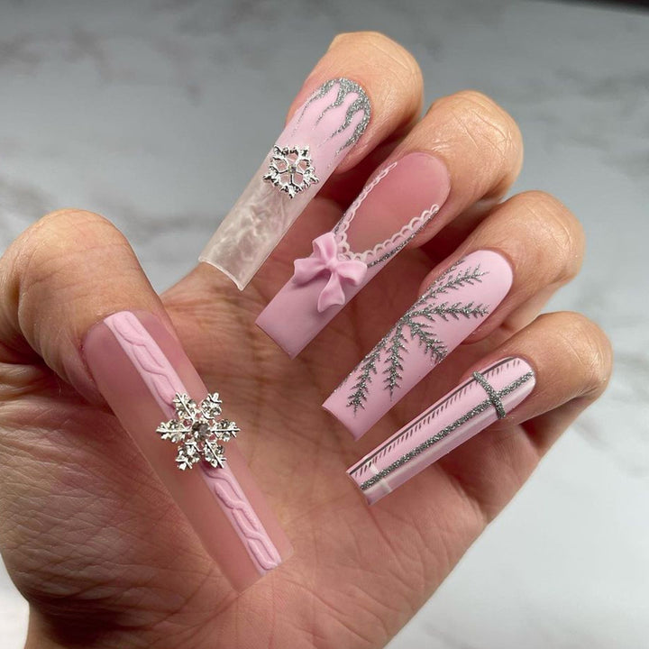 Artful nail extensions with festive decorations Stornfield