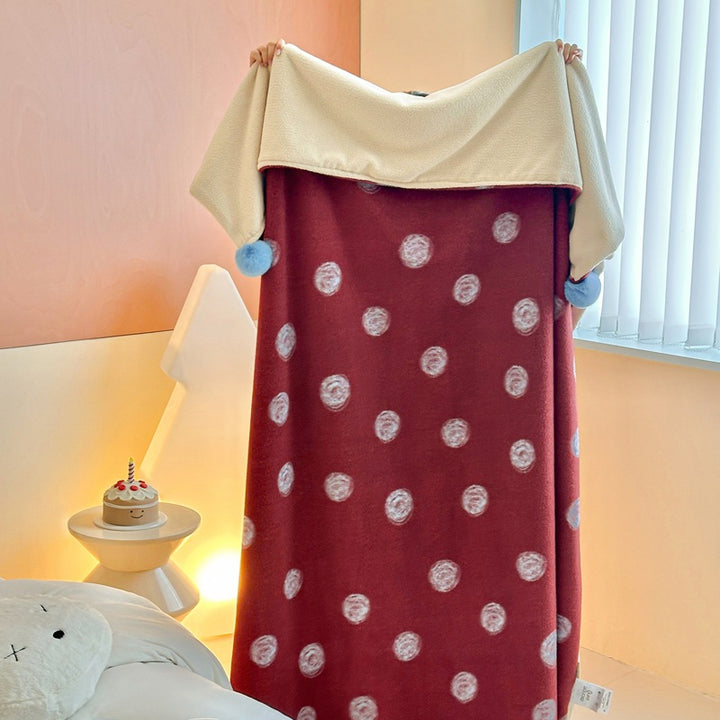 Reversible cuddly blanket made of teddy fleece and microfleece with floral pattern and fastening straps