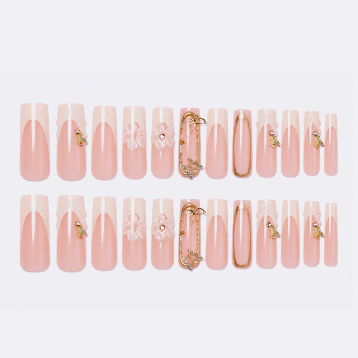 Artificial nail set with floral engravings and elegant embellishments Stornfield