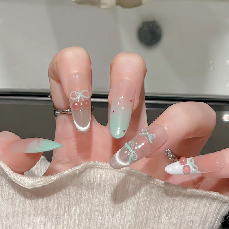 Artificial nail set with elegant bow and cherry designs Stornfield