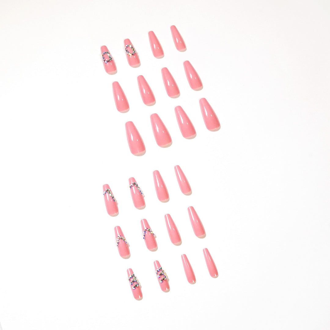 Artificial nail extensions with elegant rhinestone embellishments Stornfield