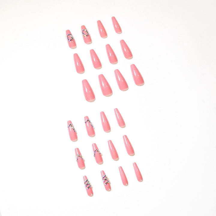 Artificial nail extensions with elegant rhinestone embellishments Stornfield