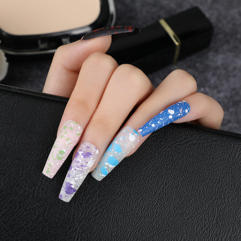 Artistic splatter design artificial nails Stornfield