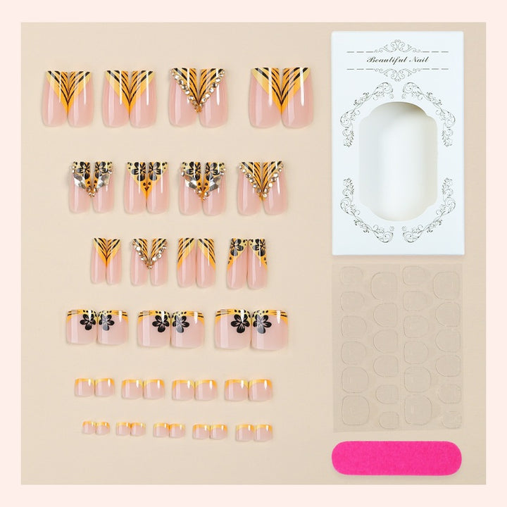 Artificial nail art with extravagant designs and glitter elements Stornfield