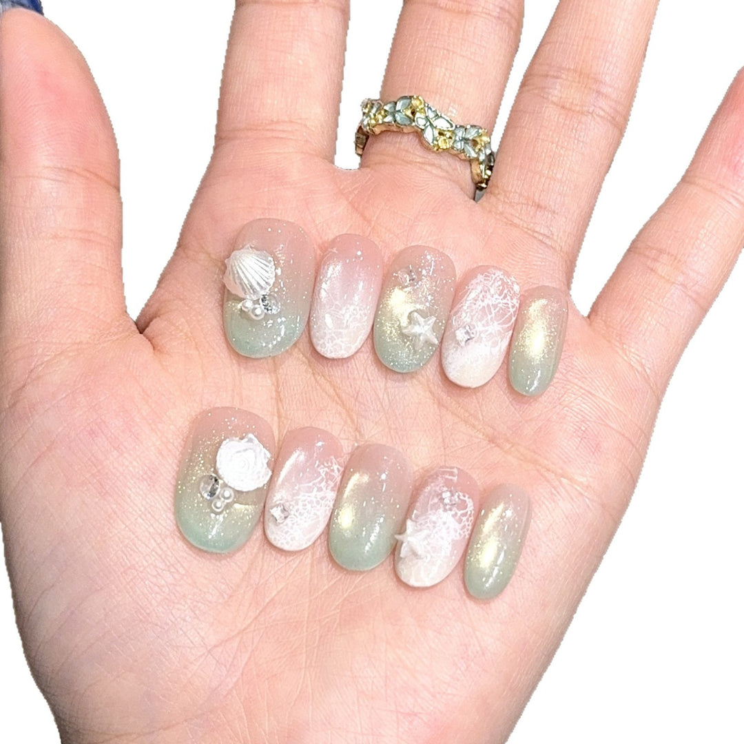 Artificial nail tips with maritime design and glitter effects Stornfield