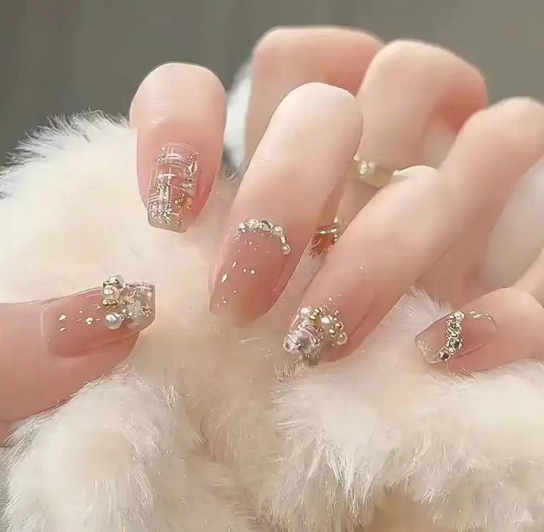Elegant Nail Art with Glitter and Rhinestones Stornfield