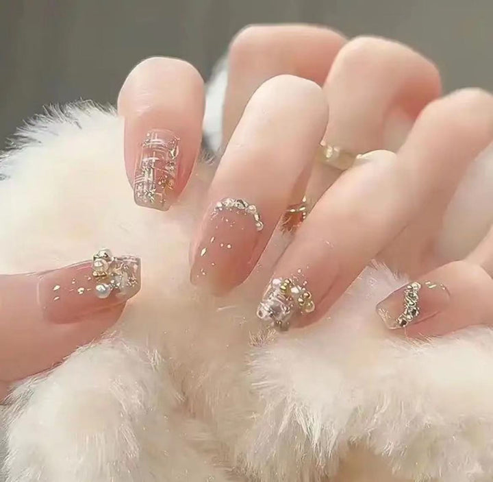 Elegant Nail Art with Glitter and Rhinestones Stornfield