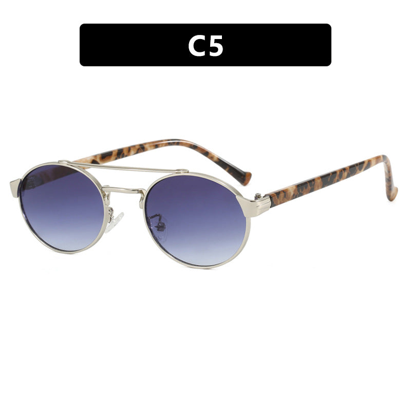 Ladies fashionable sunglasses in stylish round design with golden accents Stornfield