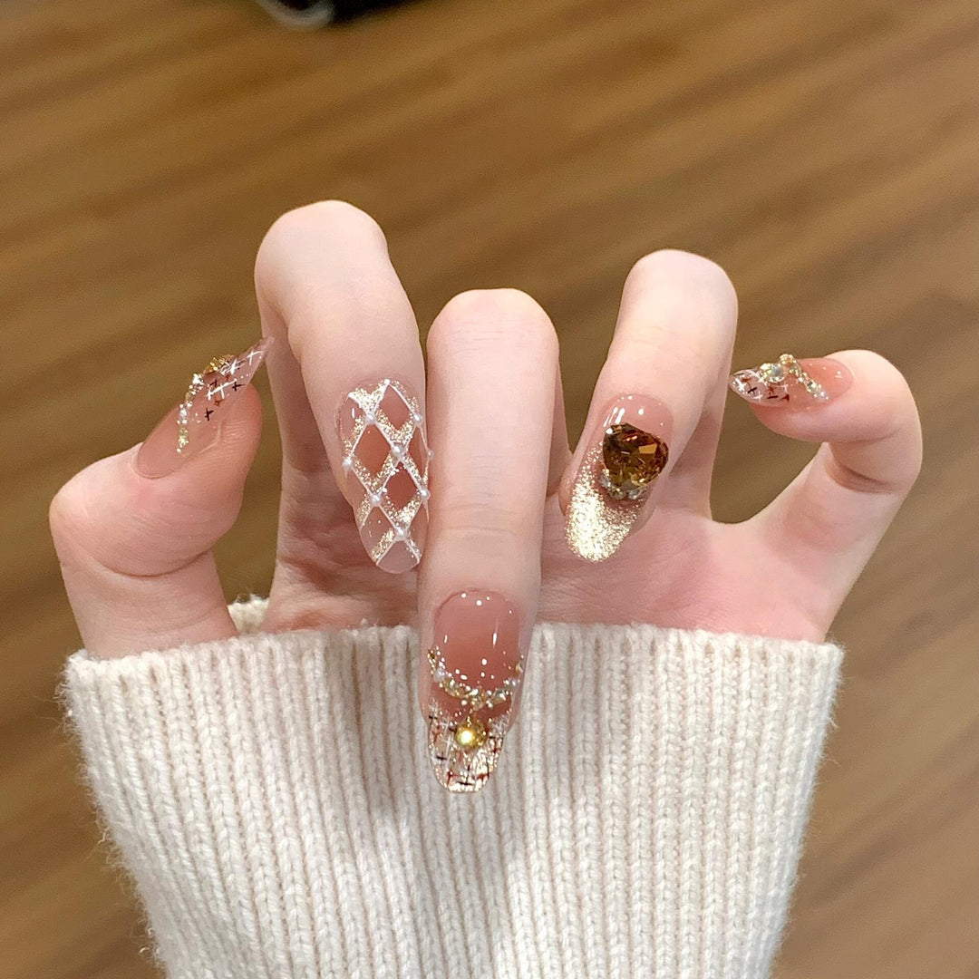 Glamorous artificial nails with glitter and heart design Stornfield