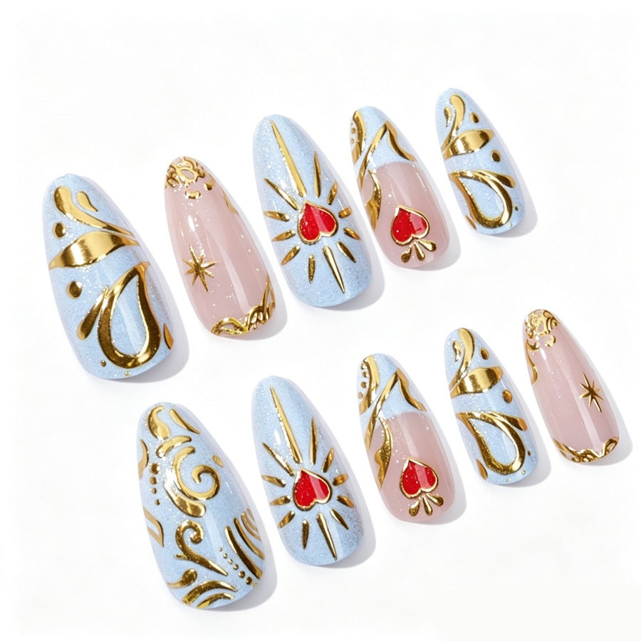 Artificial nail set with filigree golden accents and romantic heart motifs Stornfield