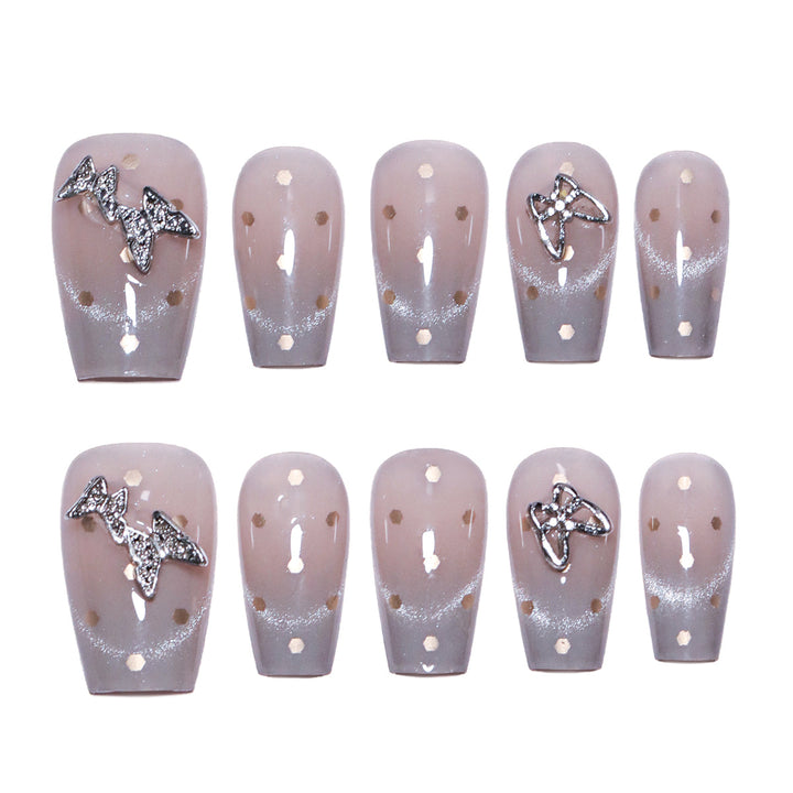 Artificial nail art with glitter details and bow accents Stornfield