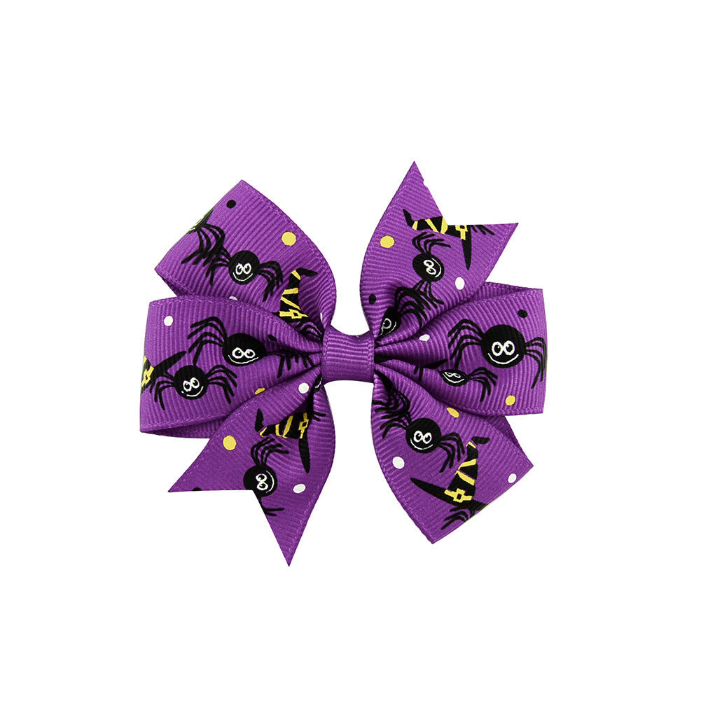 Halloween bow with pumpkin and witch motifs
