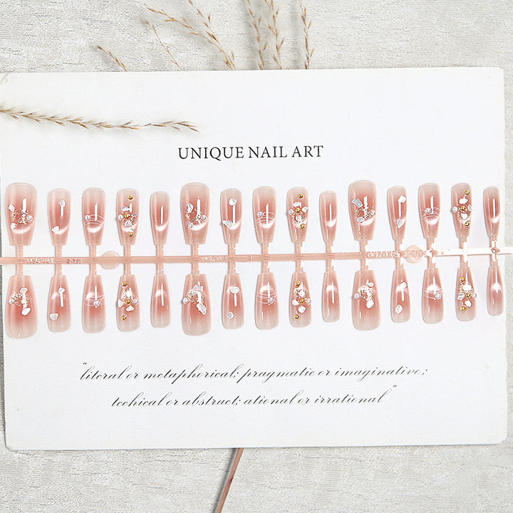 Artificial nail set with elegant glitter and flower decorations Stornfield
