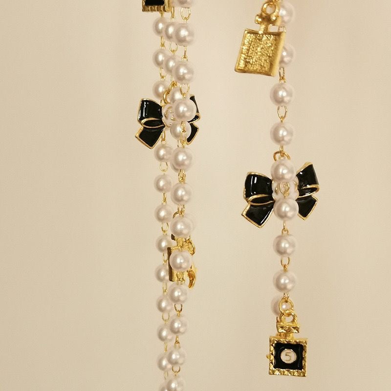 Fashionable glasses holder chain with pearls and pendants Stornfield