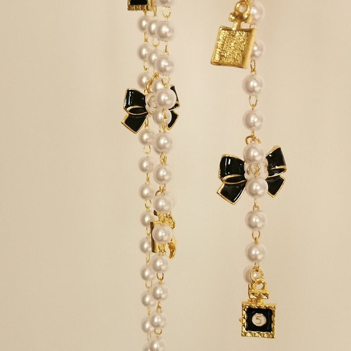 Fashionable glasses holder chain with pearls and pendants Stornfield