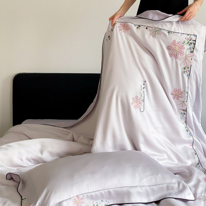 Luxurious silk bedding set with embroidered floral design