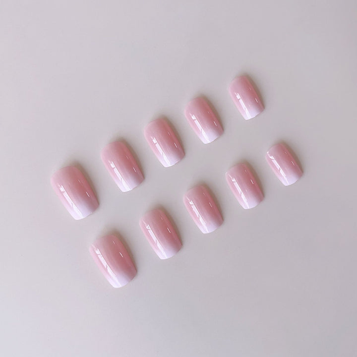 Acrylic nail set with elegant ombre design and glitter accents Stornfield