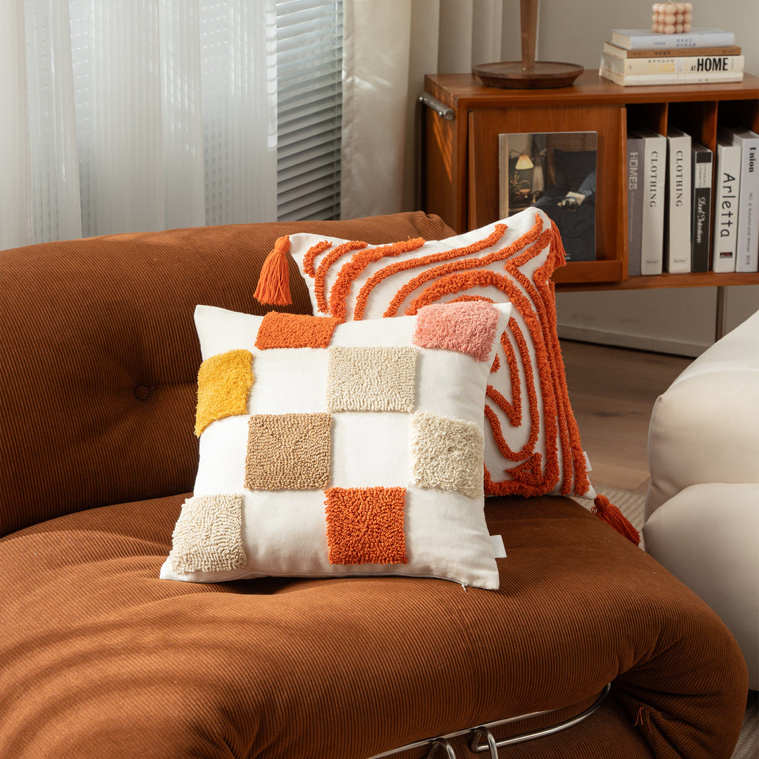 Decorative pillow with textured square appliqués and cotton cover