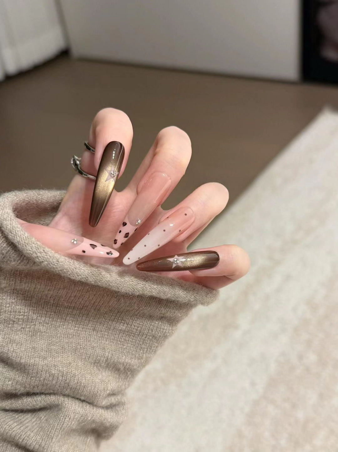 Artistic Stiletto Nail Extensions with Patterned Designs