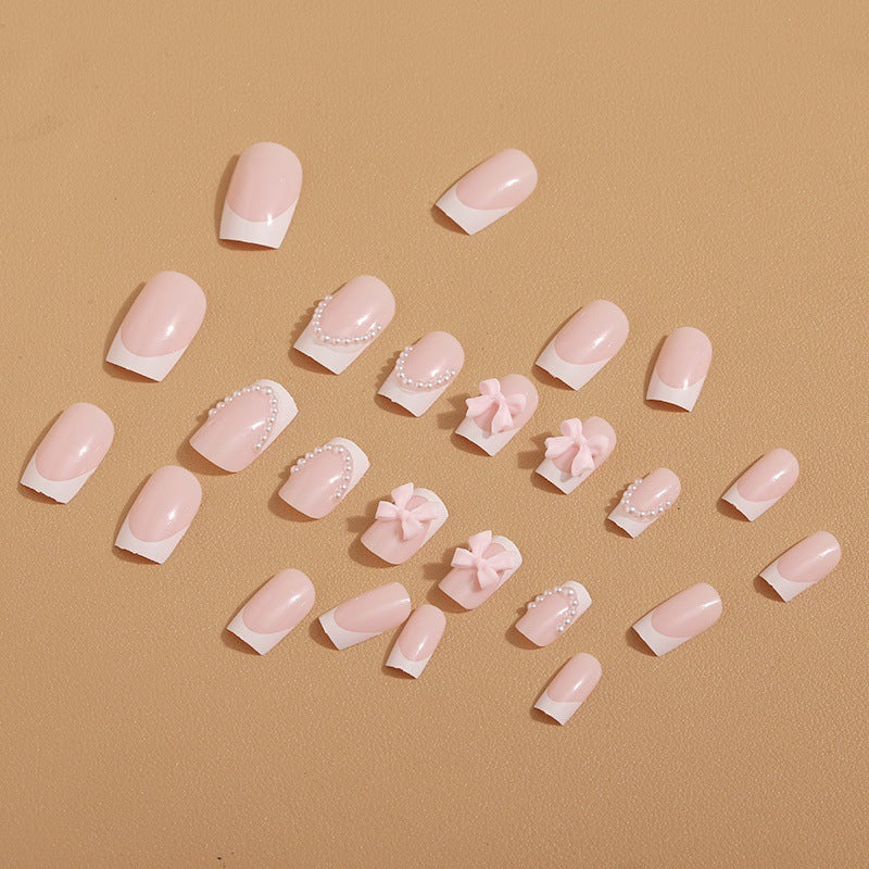 Artificial nail tips with elegant bows and pearl decorations Stornfield