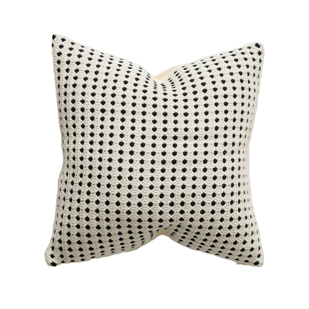Woven decorative pillow with textured dot tufting