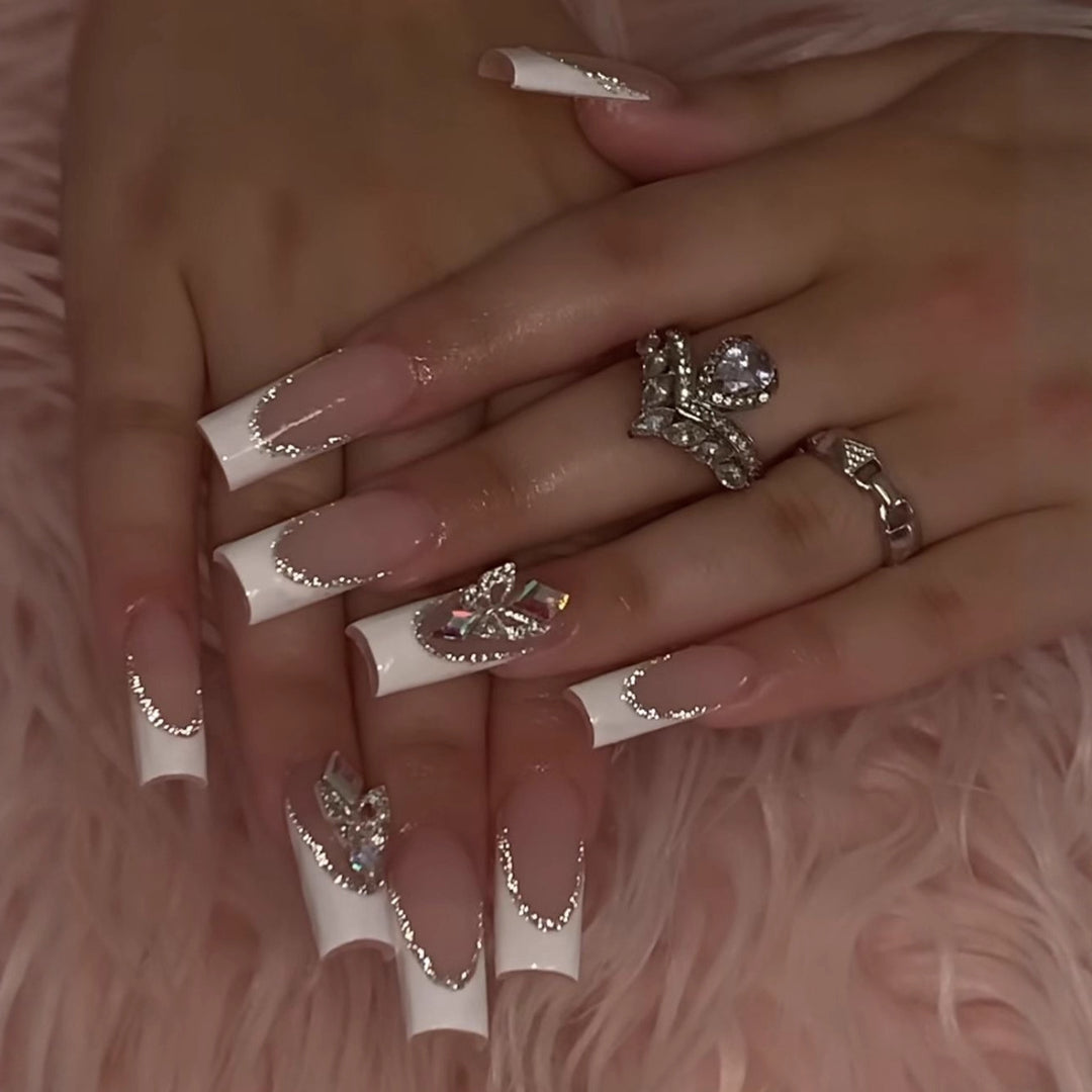 Acrylic nail set with elegant rhinestone and modern tip decorations Stornfield