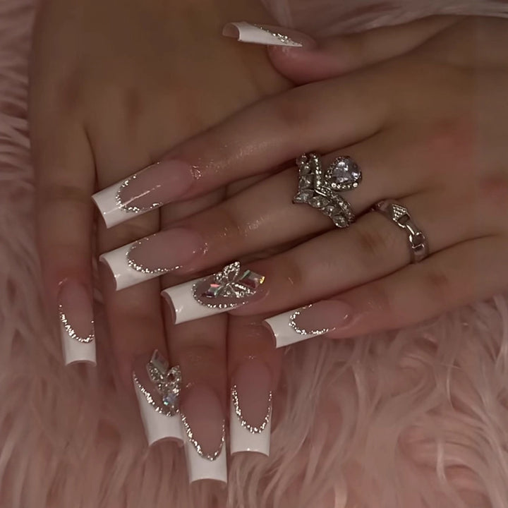 Acrylic nail set with elegant rhinestone and modern tip decorations Stornfield