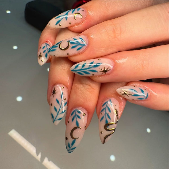 Artistic Leaf and Star Nail Art