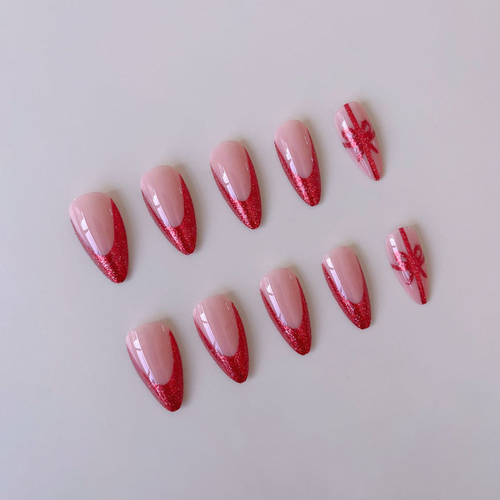 Nail set with glamorous glitter accents and bow design Stornfield