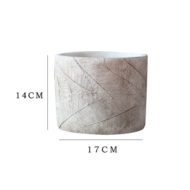 Decorative plant container made of handmade ceramic with leaf pattern Stornfield