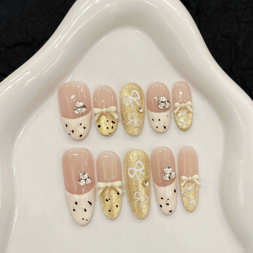 Artistic Press-On Nail Art Set with Charming Bow and Gem Accents