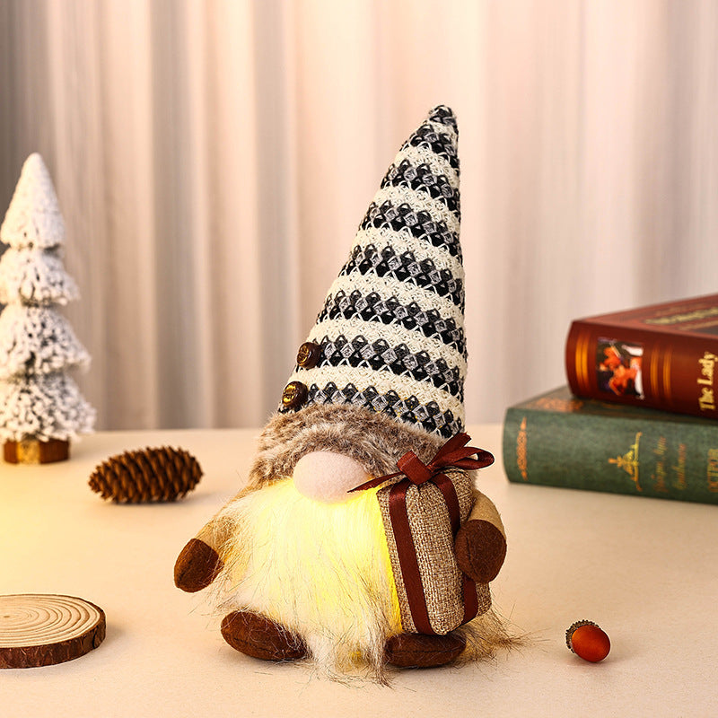 Decorative Christmas gnome with gift package Stornfield