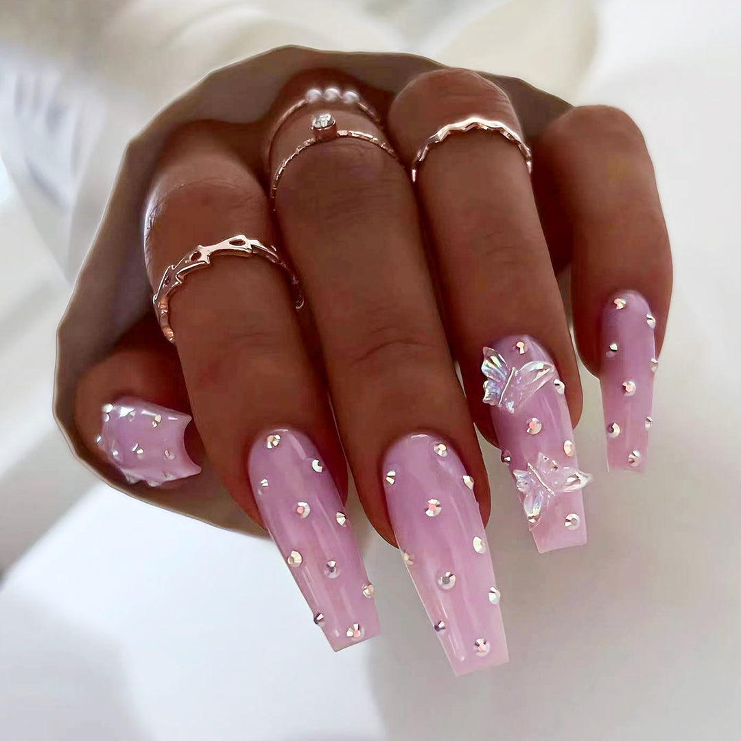 Artistic nail extensions with rhinestone and butterfly adornments Stornfield