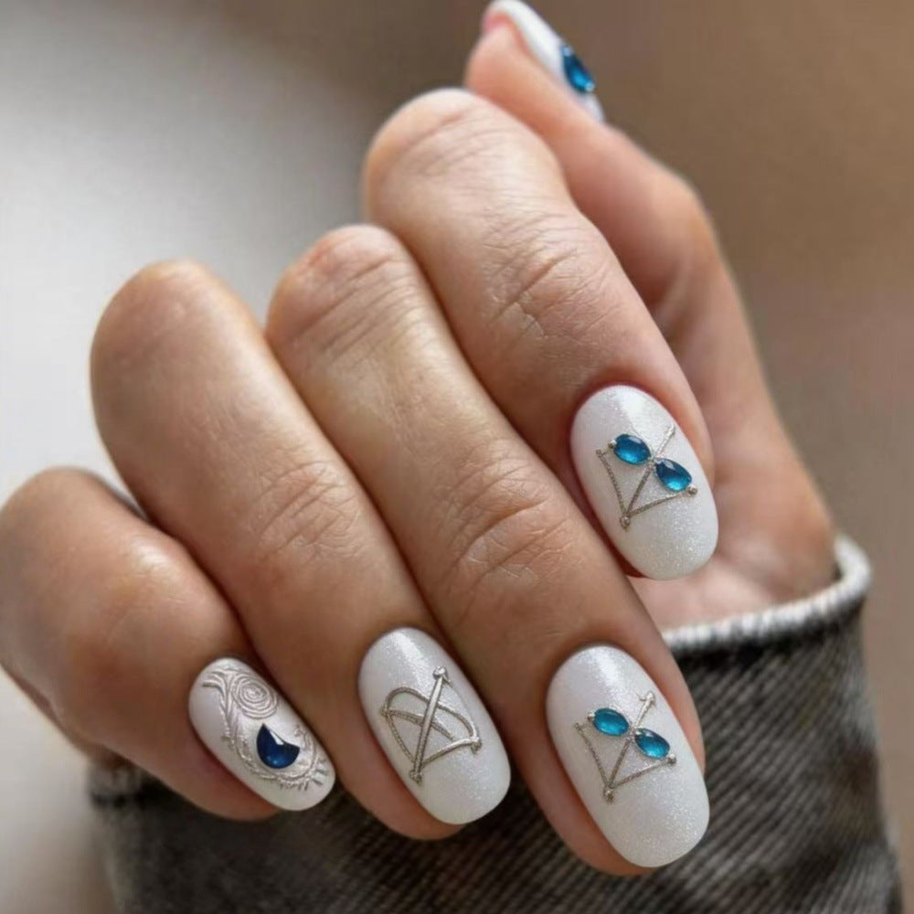 Artificial nails with noble glitter accents and symbol motif Stornfield