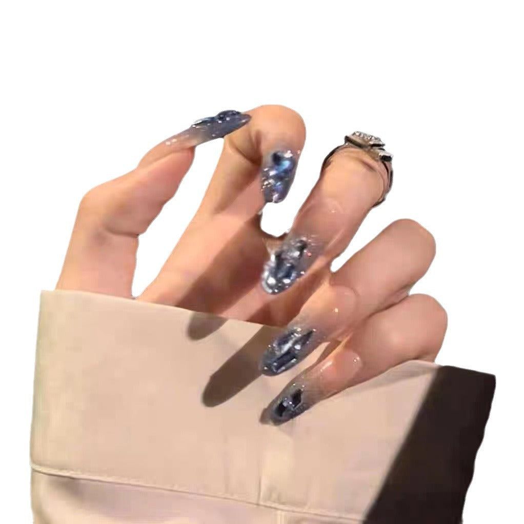 Artificial nails in creative moon and star design Stornfield