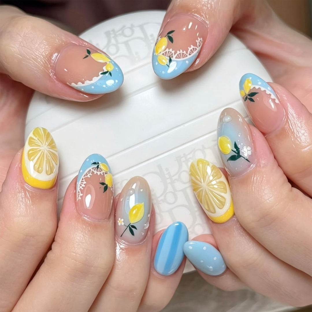 Artificial nail art with lemon and flower motifs Stornfield