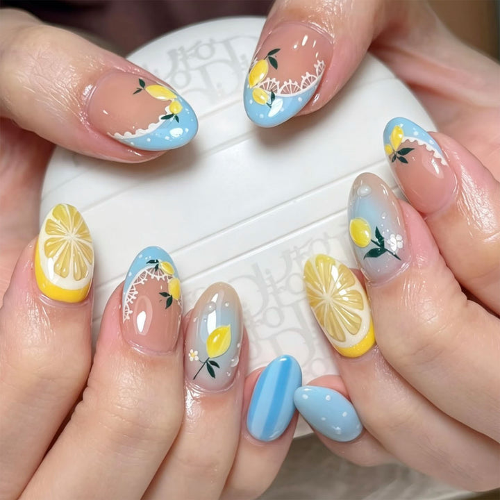 Artificial nail art with lemon and flower motifs Stornfield