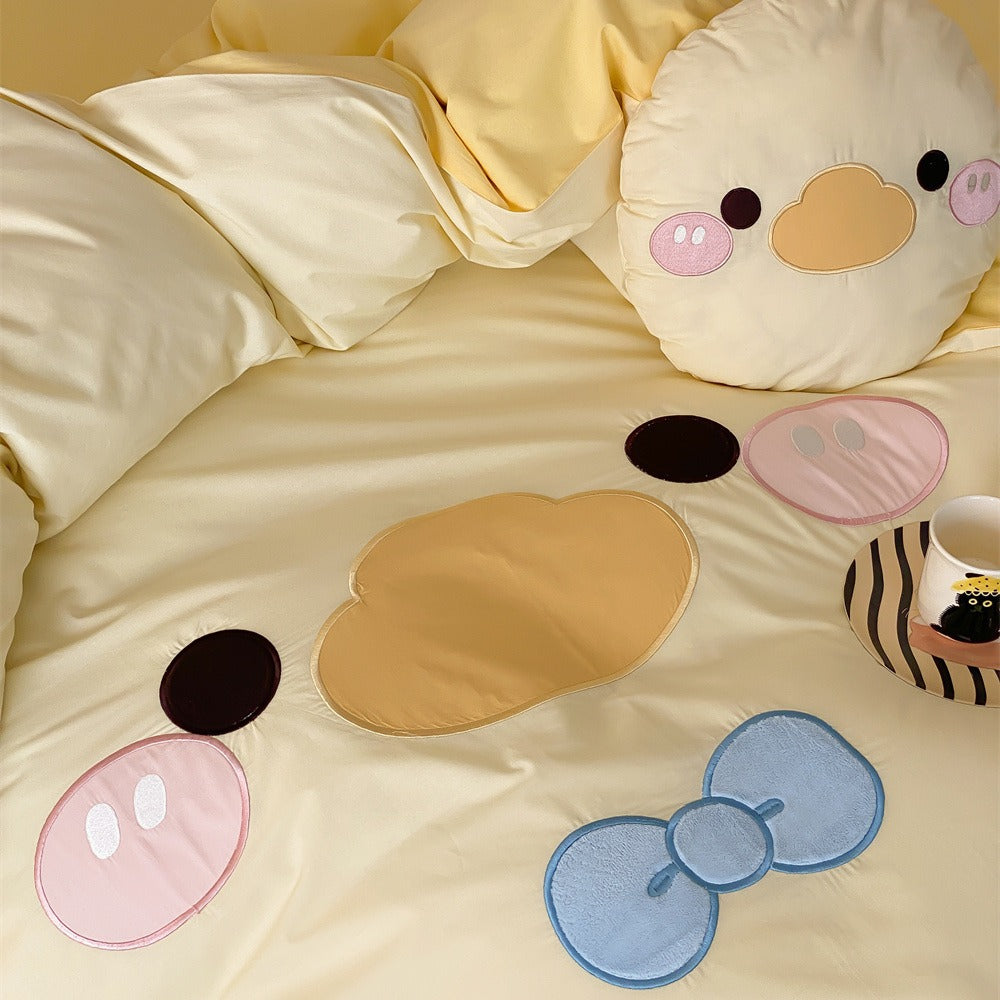 Children's bedding set with embroidered duck motif, reversible cover and cuddle pillow