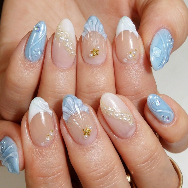Artificial nail set with floral decorations and sparkling accents Stornfield