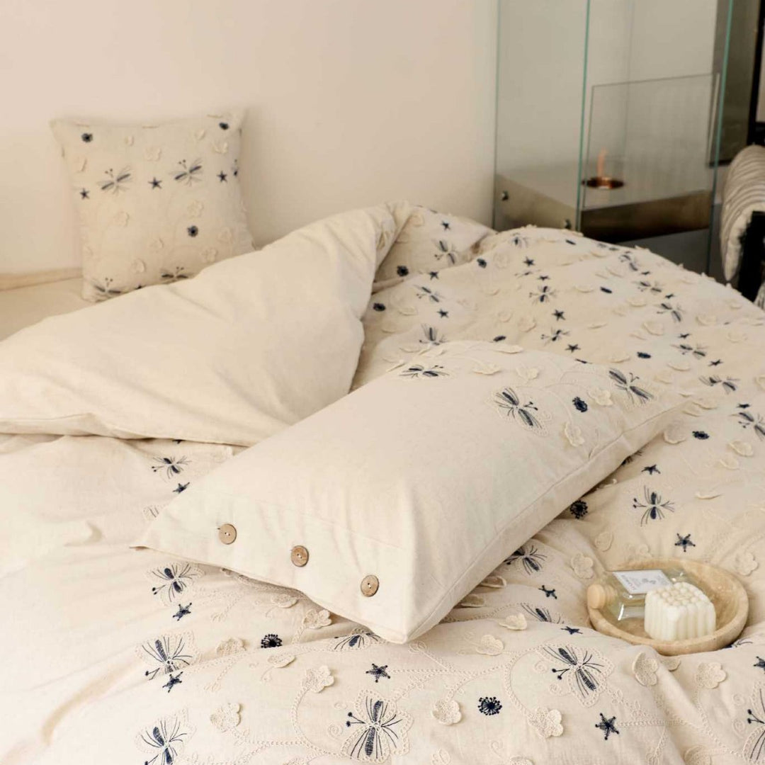 Embroidered cotton bedding set with wooden buttons and butterfly appliqués