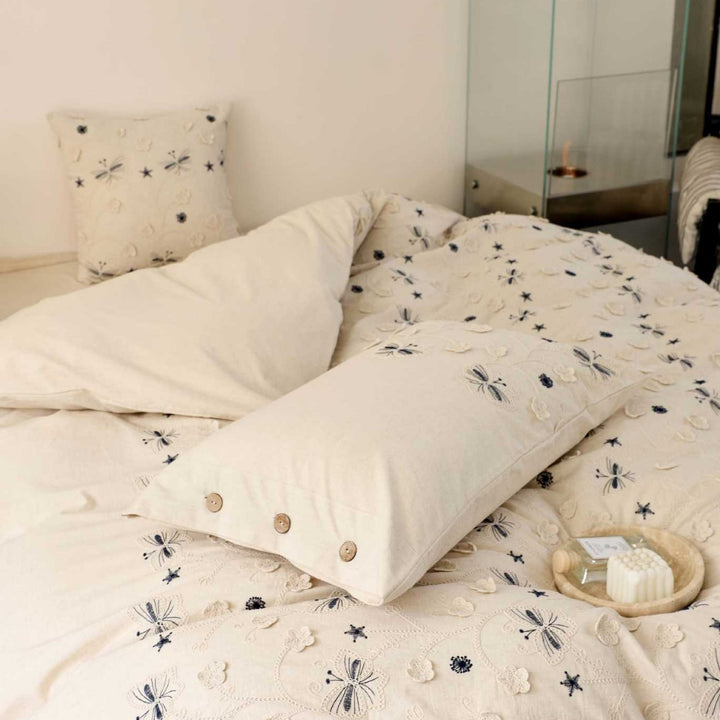 Embroidered cotton bedding set with wooden buttons and butterfly appliqués