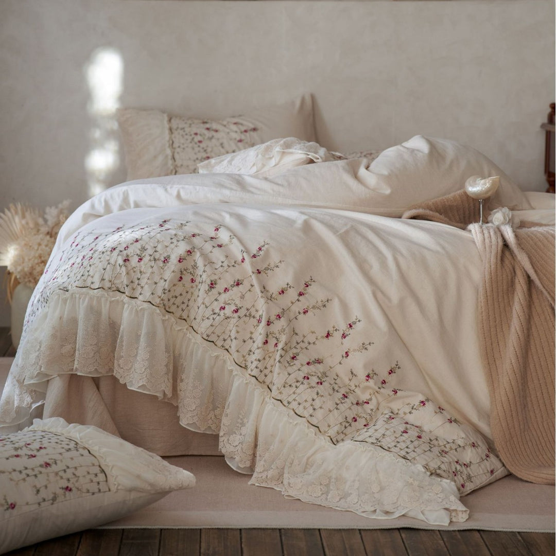 Vintage-inspired ruffled blanket and pillow set made of cotton muslin with delicate floral embroidery