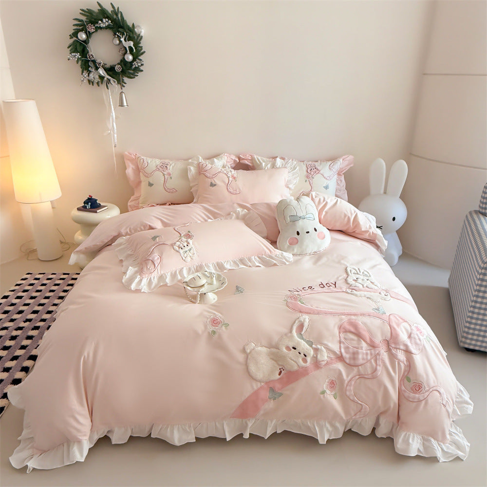 Romantic cotton satin bedding set with ruffles, plush appliqués and fine embroidery