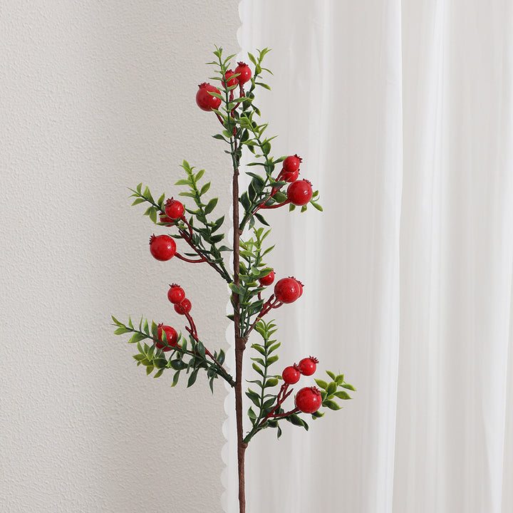 Artificial branch with glowing red berries