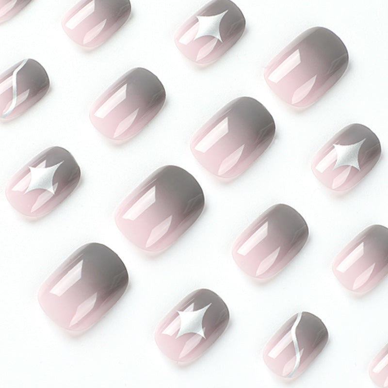 Artificial nail art with elegant ombre design and charming accents Stornfield