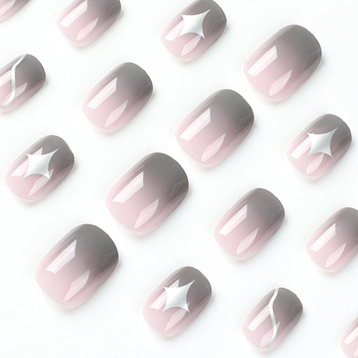 Artificial nail art with elegant ombre design and charming accents Stornfield