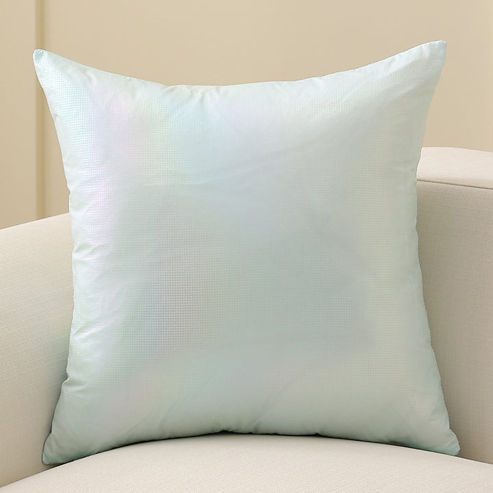 Square decorative cushion with delicate mother-of-pearl look and fine micro tuft structure